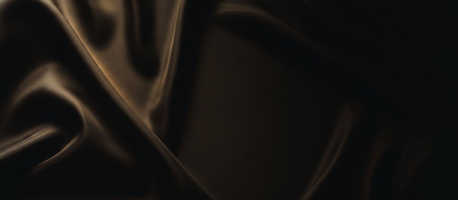 Illustrative image of folds of dark silk; not a photograph of the practice.
